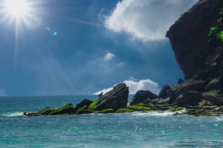 hill rock with beach